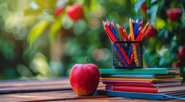 Books, Pencils, and Apple on Table photo