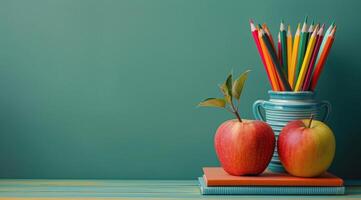 Books, Pencils, and Apple on Table photo