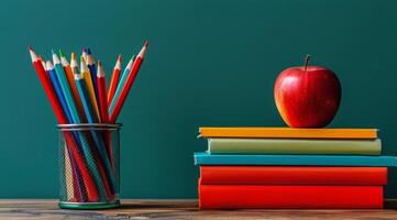 Books, Pencils, and Apple on Table photo