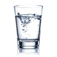 a glass of water with bubbles on a white background photo