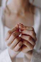 A woman is holding a ring in her hand photo