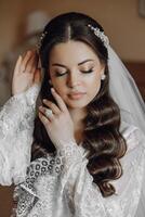 A woman with long hair and a wedding ring on her left hand photo