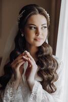 A woman with long hair is holding a ring in her hand photo