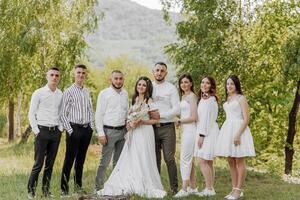 A group of people are posing for a photo in a field