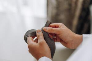 A man is tying his tie photo