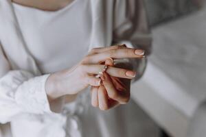 A woman is holding a ring in her hand photo