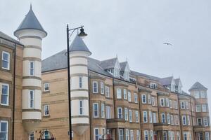 Modern brick buildings with cylindrical towers photo