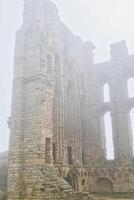 Misty Ancient Castle Ruin in Tynemouth Priory and Castle photo