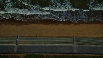 Aerial view of beach and promenade with waves in Sandsend, Yorkshire photo