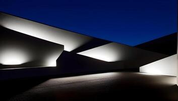 Modern architecture at night with illuminated facade and geometric shapes against a dark sky. photo