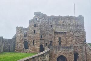 Historic stone castle with tower on an overcast day in Tynemouth Priory and Castle photo