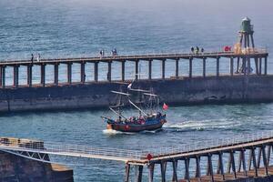 Vintage Sailing Ship in Harbor in Whitby, North Yorkshire photo