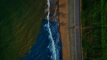 Aerial view of coastline with waves and walkway in Sandsend, Yorkshire photo