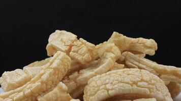 Rambak or kerupuk kulit sapi. Cow skin cracker is common side dish in Indonesia made from fried seasoned cow skin. perfect for recipe, catalog or any cooking contents. photo