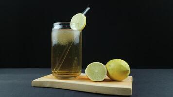 Glass of tasty Long Island iced tea on dark background with space for text photo