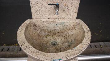 photo of a faucet and sink in the city park