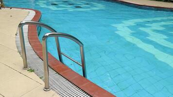 Swimming pool with stairs, swimming pool handrails photo