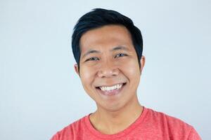 head shot happy facial expression smiling asian man looking at the camera, isolated white background photo