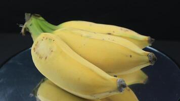 Bunch of bananas on black background photo