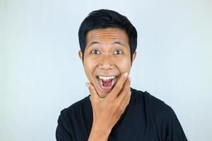 head shot wow facial expression smiling asian man looking at the camera, isolated white background photo