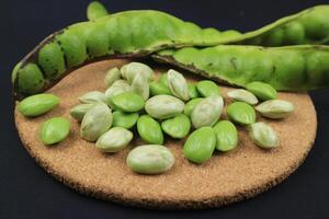 Raw of petai or pete kupas. Usually eaten raw and cooked popular with name stink bean or bitter bean photo