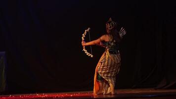 Traditional dancer performing on dimly lit stage video