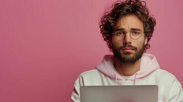 Man Working on Laptop at Table photo