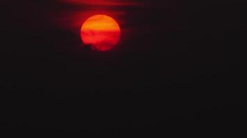 Red sun with clouds. Fiery red sunset background. Horror, cataclysm, armageddon, war, terror, terrorism, disaster, end of the world, concept video