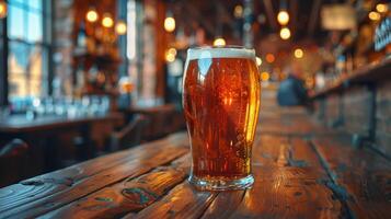 Glass of Beer on Wooden Table photo