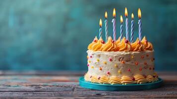 Cake With White Frosting and Lit Candles photo