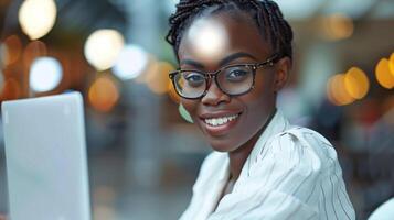 Woman Smiling Using Laptop photo
