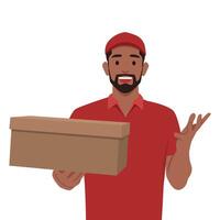 Young delivery man in red uniform holds a cardboard box in his hands. vector