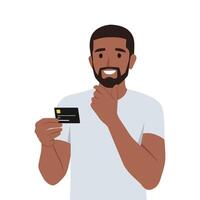 Young man thinking about using black credit card. He is holding credit card on his hand while thinking. vector