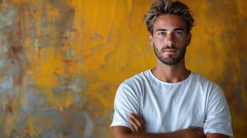 Man Standing With Arms Crossed in Front of Painting photo