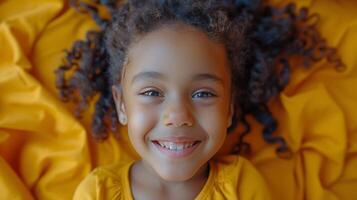 Little Girl With Curly Hair Laying on Bed photo