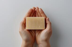 Person Holding Soap Bar photo