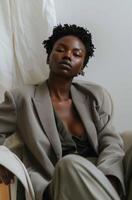 Woman in Suit Sitting in Chair photo