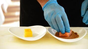 Professional chef hands oozes a piece of salmon video