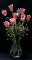 Pink Flowers in Vase on Table photo