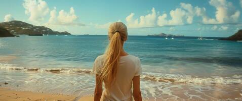 Woman Standing on Top of Sandy Beach photo