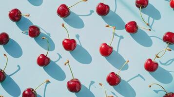 Group of Cherries on Blue Surface photo