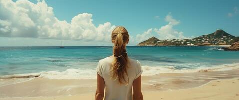 Woman Standing on Top of Sandy Beach photo