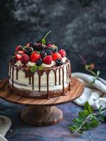 minimal cake with white frosting and chocolate drizzle photo