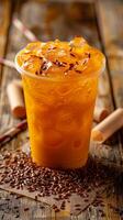 Thai tea with ice in a plastic cup photo