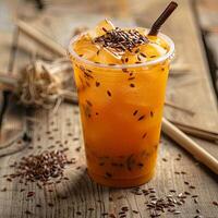 Thai tea with ice in a plastic cup photo