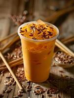 Thai tea with ice in a plastic cup photo