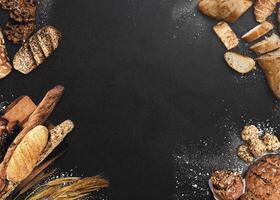 Various breads are placed in a circle on a concrete background photo