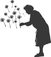 silhouette elderly woman blows dandelion flower black color only vector