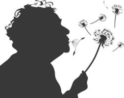 silhouette elderly woman blows dandelion flower black color only vector