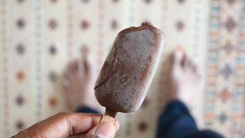 pov shot of young men holding chocolate flavor ice video